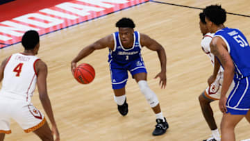 Drake guard Joseph Yesufu (1) attempts to drive the ball past USC forward Evan Mobley (4) during the first round of the 2021 NCAA Tournament on Saturday, March 20, 2021, at Bankers Life Fieldhouse in Indianapolis, Ind. Mandatory Credit: Adam Cairns/IndyStar via USA TODAY Sports