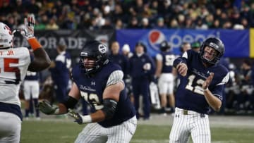 NEW YORK, NY - NOVEMBER 17: Ian Book #12 of the Notre Dame Fighting Irish passes against Syracuse Orange during their game at Yankee Stadium on November 17, 2018 in New York, New York. (Photo by Jeff Zelevansky/Getty Images)