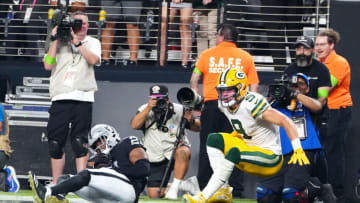 Oct 9, 2023; Paradise, Nevada, USA; Las Vegas Raiders cornerback Amik Robertson (21) intercepts a pass intended for Green Bay Packers wide receiver Christian Watson (9) at the end of the fourth quarter at Allegiant Stadium. Mandatory Credit: Stephen R. Sylvanie-USA TODAY Sports