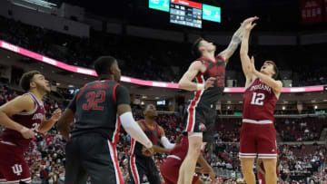 Indiana Hoosiers forward Miller Kopp (12) is guarded by Ohio State Buckeyes forward Kyle Young (25) during the second half of Monday's NCAA Division I basketball game at Value City Arena in Columbus, Oh., on February 21, 2022. The Buckeyes won the game 80-69 in overtime.Ceb Osumbk 0220 Bjp 20