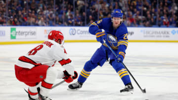 Apr 8, 2023; Buffalo, New York, USA; Carolina Hurricanes left wing Jordan Martinook (48) looks to block a pass by Buffalo Sabres defenseman Rasmus Dahlin (26) during the second period at KeyBank Center. Mandatory Credit: Timothy T. Ludwig-USA TODAY Sports
