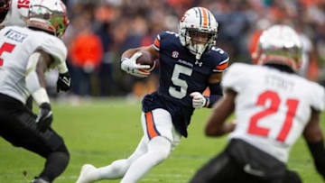 Auburn football wide receiver Jay Fair (5) turns up field after making a catch as Auburn Tigers take on Western Kentucky Hilltoppers at Jordan-Hare Stadium in Auburn, Ala., on Saturday, Nov. 19, 2022.
