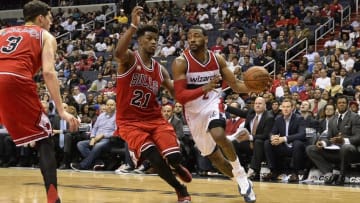 Mar 16, 2016; Washington, DC, USA; Washington Wizards guard John Wall (2) drive to the basket as Chicago Bulls guard Jimmy Butler (21) defends during the second half at Verizon Center. Washington defeated Chicago 117-96. Mandatory Credit: Tommy Gilligan-USA TODAY Sports