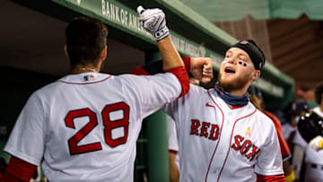 BOSTON, MA - SEPTEMBER 5: J.D. Martinez #28 of the Boston Red Sox high fives Alex Verdugo #99 after hitting a solo home run during the second inning of a game against the Toronto Blue Jays on September 5, 2020 at Fenway Park in Boston, Massachusetts. The 2020 season had been postponed since March due to the COVID-19 pandemic. (Photo by Billie Weiss/Boston Red Sox/Getty Images)