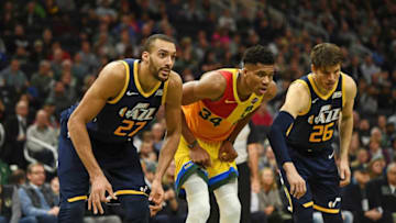 MILWAUKEE, WISCONSIN - JANUARY 07: Giannis Antetokounmpo #34 of the Milwaukee Bucks is defended by Rudy Gobert #27 and Kyle Korver #26 of the Utah Jazz during a game at Fiserv Forum on January 07, 2019 in Milwaukee, Wisconsin. NOTE TO USER: User expressly acknowledges and agrees that, by downloading and or using this photograph, User is consenting to the terms and conditions of the Getty Images License Agreement. (Photo by Stacy Revere/Getty Images)