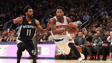 Oct 29, 2016; New York, NY, USA; New York Knicks guard Derrick Rose (25) dribbles the ball past Memphis Grizzlies guard Mike Conley (11) during the third quarter at Madison Square Garden. New York Knicks won 111-104. Mandatory Credit: Anthony Gruppuso-USA TODAY Sports