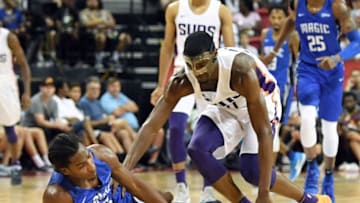 LAS VEGAS, NV - JULY 09: Melvin Frazier Jr. #35 of the Orlando Magic loses the ball under pressure from Josh Jackson #20 of the Phoenix Suns during the 2018 NBA Summer League at the Thomas & Mack Center on July 9, 2018 in Las Vegas, Nevada. The Suns defeated the Magic 71-53. NOTE TO USER: User expressly acknowledges and agrees that, by downloading and or using this photograph, User is consenting to the terms and conditions of the Getty Images License Agreement. (Photo by Ethan Miller/Getty Images)