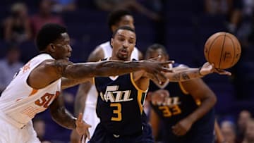 Oct 5, 2016; Phoenix, AZ, USA; Phoenix Suns guard Eric Bledsoe (2) makes a pass in front of Utah Jazz guard George Hill (3) in the first half at Talking Stick Resort Arena. Mandatory Credit: Jennifer Stewart-USA TODAY Sports