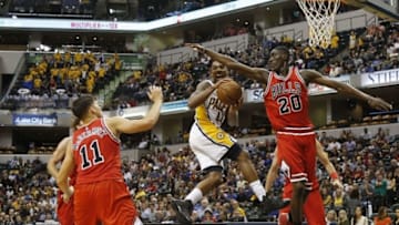 Oct 6, 2016; Indianapolis, IN, USA; Indiana Pacers guard Jeff Teague (44) passes the ball in front of Chicago Bulls forward Tony Snell (20) at Bankers Life Fieldhouse. Mandatory Credit: Brian Spurlock-USA TODAY Sports