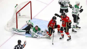 EDMONTON, ALBERTA - AUGUST 14: Derek Ryan #10 of the Calgary Flames collides with Anton Khudobin #35 of the Dallas Stars as TJ Brodie (not pictured) scores a goal during the third period in Game Three of the Western Conference First Round during the 2020 NHL Stanley Cup Playoffs at Rogers Place on August 14, 2020 in Edmonton, Alberta, Canada. (Photo by Jeff Vinnick/Getty Images) (Photo by Jeff Vinnick/Getty Images)