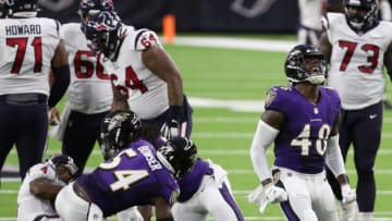 HOUSTON, TEXAS - SEPTEMBER 20: Patrick Queen #48 of the Baltimore Ravens reacts after his tackle of Deshaun Watson #4 of the Houston Texans in the backfield at NRG Stadium on September 20, 2020 in Houston, Texas. (Photo by Bob Levey/Getty Images)