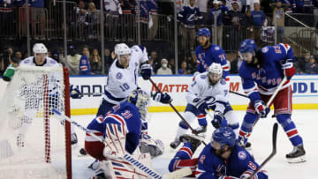 NEW YORK, NEW YORK - JUNE 03: Igor Shesterkin #31, Jacob Trouba #8 and Mika Zibanejad #93 of the New York Rangers attempt to clear the puck during the third period against the Tampa Bay Lightning in Game Two of the Eastern Conference Final of the 2022 Stanley Cup Playoffs at Madison Square Garden on June 03, 2022 in New York City. (Photo by Bruce Bennett/Getty Images)
