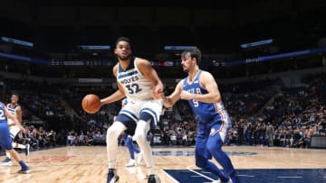 MINNEAPOLIS, MN - DECEMBER 12: Karl-Anthony Towns #32 of the Minnesota Timberwolves handles the ball against Dario Saric #9 of the Philadelphia 76ers on December 12, 2017 at Target Center in Minneapolis, Minnesota. NOTE TO USER: User expressly acknowledges and agrees that, by downloading and or using this Photograph, user is consenting to the terms and conditions of the Getty Images License Agreement. Mandatory Copyright Notice: Copyright 2017 NBAE (Photo by David Sherman/NBAE via Getty Images)