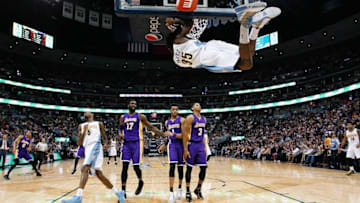 Mar 2, 2016; Denver, CO, USA; Denver Nuggets forward Kenneth Faried (35) swings on the basket after a dunk in the second quarter against the Los Angeles Lakers at the Pepsi Center. Mandatory Credit: Isaiah J. Downing-USA TODAY Sports