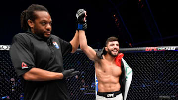 ABU DHABI, UNITED ARAB EMIRATES - JULY 19: In this handout image provided by UFC, Amir Albazi of Iraq celebrates after his submission victory over Malcolm Gordon of Canada in their bantamweight bout during the UFC Fight Night event inside Flash Forum on UFC Fight Island on July 19, 2020 in Yas Island, Abu Dhabi, United Arab Emirates. (Photo by Jeff Bottari/Zuffa LLC via Getty Images)