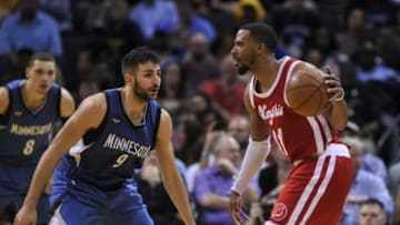 Feb 19, 2016; Memphis, TN, USA; Memphis Grizzlies guard Mike Conley (11) handles the ball against Minnesota Timberwolves guard Ricky Rubio (9) during the second half at FedExForum. Memphis Grizzlies defeated the Minnesota Timberwolves 109-104. Mandatory Credit: Justin Ford-USA TODAY Sports