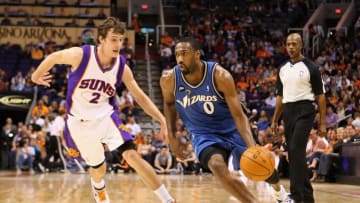 Gilbert Arenas blows past Goran Dragic of the Phoenix Suns. (Photo by Christian Petersen/Getty Images)