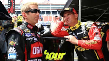 Greg Biffle (left) talks with Clint Bowyer during practice for the Food City 500 at Bristol Motor Speedway. Mandatory Credit: Andrew Weber-USA TODAY Sports