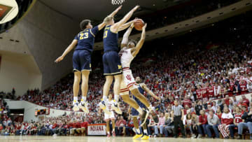 BLOOMINGTON, INDIANA - JANUARY 25: Brandon Johns Jr #23 and Ignas Brazdeikis #13 of the Michigan Wolverines defend the shot of Justin Smith #3 of the Indiana Hoosiers at Assembly Hall on January 25, 2019 in Bloomington, Indiana. (Photo by Andy Lyons/Getty Images)