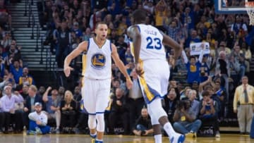 January 7, 2015; Oakland, CA, USA; Golden State Warriors guard Stephen Curry (30) celebrates with forward Draymond Green (23) against the Indiana Pacers during the second quarter at Oracle Arena. Mandatory Credit: Kyle Terada-USA TODAY Sports