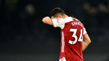 LONDON, ENGLAND - DECEMBER 06: Granit Xhaka of Arsenal looks dejected following the Premier League match between Tottenham Hotspur and Arsenal at Tottenham Hotspur Stadium on December 06, 2020 in London, England. A limited number of fans (2000) are welcomed back to stadiums to watch elite football across England. This was following easing of restrictions on spectators in tiers one and two areas only. (Photo by Glyn Kirk - Pool/Getty Images)