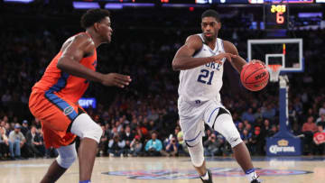 NEW YORK, NY - DECEMBER 06: Amile Jefferson #21 of the Duke Blue Devils drives to the basket against John Egbunu #15 of the Florida Gators in the second half during the Jimmy V Classic at Madison Square Garden on December 6, 2016 in New York City. (Photo by Michael Reaves/Getty Images)