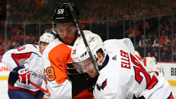 PHILADELPHIA, PA - JANUARY 08: Mark Friedman #59 of the Philadelphia Flyers battles Lars Eller #20 of the Washington Capitals at the Wells Fargo Center on January 8, 2020 in Philadelphia, Pennsylvania. (Photo by Mitchell Leff/Getty Images)