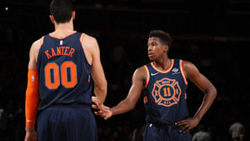 NEW YORK, NY - JANUARY 30: Frank Ntilikina #11 and Enes Kanter #00 of the New York Knicks high five during the game against the Brooklyn Nets on January 30, 2018 at Madison Square Garden in New York City, New York. Copyright 2018 NBAE (Photo by Nathaniel S. Butler/NBAE via Getty Images)
