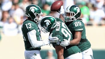 Sep 24, 2016; East Lansing, MI, USA; Michigan State Spartans defensive tackle Kevin Williams (92) celebrates a fumble recovery during the first quarter of a game against the Wisconsin Badgers at Spartan Stadium. Mandatory Credit: Mike Carter-USA TODAY Sports