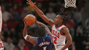 Minnesota Timberwolves forward Anthony Edwards shoots with Chicago Bulls guard Ayo Dosunmu defending. Mandatory Credit: Dennis Wierzbicki-USA TODAY Sports