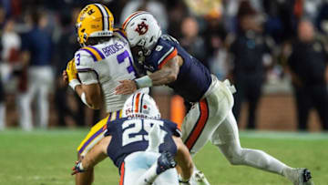 Auburn football quarterback Robby Ashford (9) tackles LSU Tigers safety Greg Brooks Jr. (3) after he intercepts his pass as Auburn Tigers take on LSU Tigers at Jordan-Hare Stadium in Auburn, Ala., on Saturday, Oct. 1, 2022. LSU Tigers defeated Auburn Tigers 21-17.