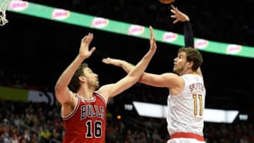 Jan 9, 2016; Atlanta, GA, USA; Atlanta Hawks center Tiago Splitter (11) shoots over Chicago Bulls center Pau Gasol (16) during the first half at Philips Arena. Mandatory Credit: Dale Zanine-USA TODAY Sports