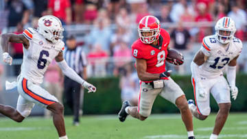 Auburn footballOct 8, 2022; Athens, Georgia, USA; Georgia Bulldogs wide receiver Dominick Blaylock (8) runs after a catch against Auburn Tigers cornerback Keionte Scott (6) during the second half at Sanford Stadium. Mandatory Credit: Dale Zanine-USA TODAY Sports