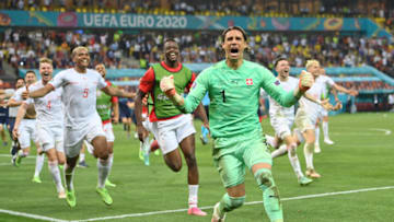 Switzerland celebrate after beating France on penalties. (Photo by Justin Setterfield/Getty Images)