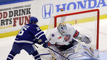 Toronto's Nick Abruzzese silice the puck in front of Amerks goalie Ukko-Pekka Luukkonen.