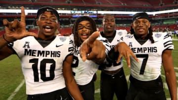 TAMPA, FLORIDA - NOVEMBER 23: The Memphis Tigers celebrate winning a game against the South Florida Bulls at Raymond James Stadium on November 23, 2019 in Tampa, Florida. (Photo by Mike Ehrmann/Getty Images)