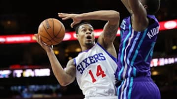 Oct 8, 2014; Philadelphia, PA, USA; Philadelphia 76ers guard K.J. McDaniels (14) goes up for a shot against Charlotte Hornets forward Michael Kidd-Gilchrist (14) at the Wells Fargo Center. The 76ers defeated the Hornets 106-92. Mandatory Credit: Bill Streicher-USA TODAY Sports