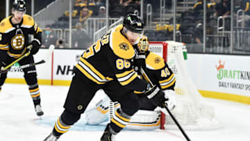 May 21, 2021; Boston, Massachusetts, USA; Boston Bruins defenseman Kevan Miller (86) controls the puck during the first period in game four of the first round of the 2021 Stanley Cup Playoffs against the Washington Capitals at TD Garden. Mandatory Credit: Bob DeChiara-USA TODAY Sports