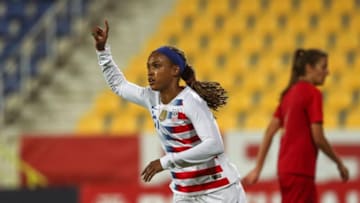 LISBON, PORTUGAL - NOVEMBER 08: Jessica McDonald #21 of the United States celebrates scoring a goal during the international friendly match between Portugal and the United States at Estadio Jose Coimbra da Mota on November 8, 2018 in Estoril, Portugal. (Photo by Carlos Rodrigues/Getty Images)