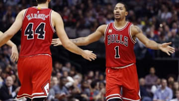 Dec 26, 2015; Dallas, TX, USA; Chicago Bulls guard Derrick Rose (1) and forward Nikola Mirotic (44) celebrate during the second half against the Dallas Mavericks at American Airlines Center. Mandatory Credit: Kevin Jairaj-USA TODAY Sports