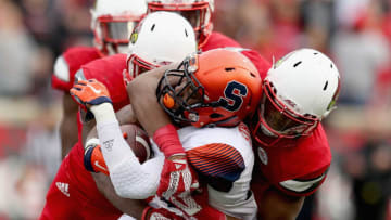 LOUISVILLE, KY - NOVEMBER 07: Steve Ishmael #8 of the Syracuse Orange is tackled by the Louisville Cardinals defense during the game at Papa John's Cardinal Stadium on November 7, 2015 in Louisville, Kentucky. (Photo by Andy Lyons/Getty Images)