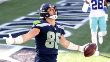 SEATTLE, WASHINGTON - SEPTEMBER 27: Jacob Hollister #86 of the Seattle Seahawks celebrates in the end zone after scoring a touchdown against the Dallas Cowboys during the third quarter in the game at CenturyLink Field on September 27, 2020 in Seattle, Washington. (Photo by Abbie Parr/Getty Images)