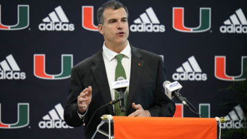 MIAMI, FLORIDA - DECEMBER 07: New Head Coach Mario Cristobal of the Miami Hurricanes speaks with the media during a press conference introducing him at the Carol Soffer Indoor Practice Facility at University of Miami on December 07, 2021 in Miami, Florida. Cristobal becomes the 26th head football coach in the programs history (Photo by Mark Brown/Getty Images)