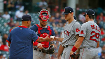Alex Cora #13 removes Tanner Houck #89 of the Boston Red Sox (Photo by Justin K. Aller/Getty Images)