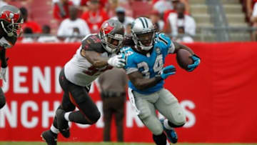 Sep 7, 2014; Tampa, FL, USA; Carolina Panthers running back DeAngelo Williams (34) runs past Tampa Bay Buccaneers middle linebacker Mason Foster (59) during the second half at Raymond James Stadium. Carolina Panthers defeated the Tampa Bay Buccaneers 20-14. Mandatory Credit: Kim Klement-USA TODAY Sports