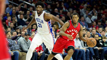 Dec 14, 2016; Philadelphia, PA, USA; Toronto Raptors guard Kyle Lowry (7) dribbles past Philadelphia 76ers center Joel Embiid (21) during the first quarter at Wells Fargo Center. Mandatory Credit: Bill Streicher-USA TODAY Sports