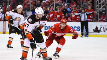 Jan 23, 2016; Detroit, MI, USA; Anaheim Ducks center Ryan Kesler (17) shoots ands scores a goal while being defended by Detroit Red Wings center Riley Sheahan (15) during the third period at Joe Louis Arena. Anaheim won 4-3. Mandatory Credit: Tim Fuller-USA TODAY Sports