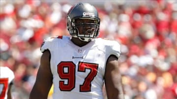 Sep 29, 2013; Tampa, FL, USA; Tampa Bay Buccaneers defensive tackle Akeem Spence (97) against the Arizona Cardinals during the first quarter at Raymond James Stadium. Mandatory Credit: Kim Klement-USA TODAY Sports