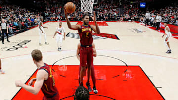 PORTLAND, OREGON - JANUARY 07: Evan Mobley # 4 of the Cleveland Cavaliers grabs a rebound during the second half against the Portland Trail Blazers at Moda Center on January 07, 2022 in Portland, Oregon. NOTE TO USER: User expressly acknowledges and agrees that, by downloading and or using this photograph, User is consenting to the terms and conditions of the Getty Images License Agreement. (Photo by Soobum Im/Getty Images)