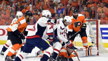 Apr 24, 2016; Philadelphia, PA, USA; Washington Capitals right wing Justin Williams (14) attempts to shoot the puck as Philadelphia Flyers defenseman Nick Schultz (55) falls to the ice during the first period in game six of the first round of the 2016 Stanley Cup Playoffs at Wells Fargo Center. Mandatory Credit: Derik Hamilton-USA TODAY Sports